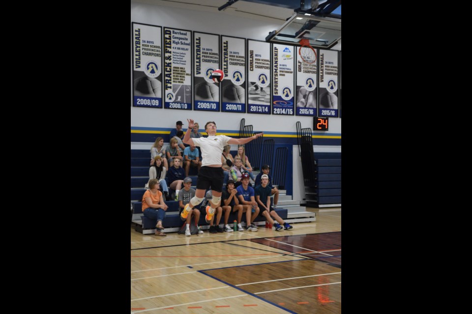 Tristan Hiemstra of the Tiemstra/Shurling 2006 alum team with a jumping serve in a Sept. 2 round-robin game against Barrhead Composite High School.