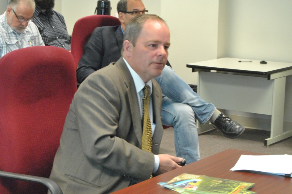 Troy Grainger pictured here in a 2015 Woodlands County council meeting said the REDA will continue to deliver services despite having its operational budget serverly slashed.