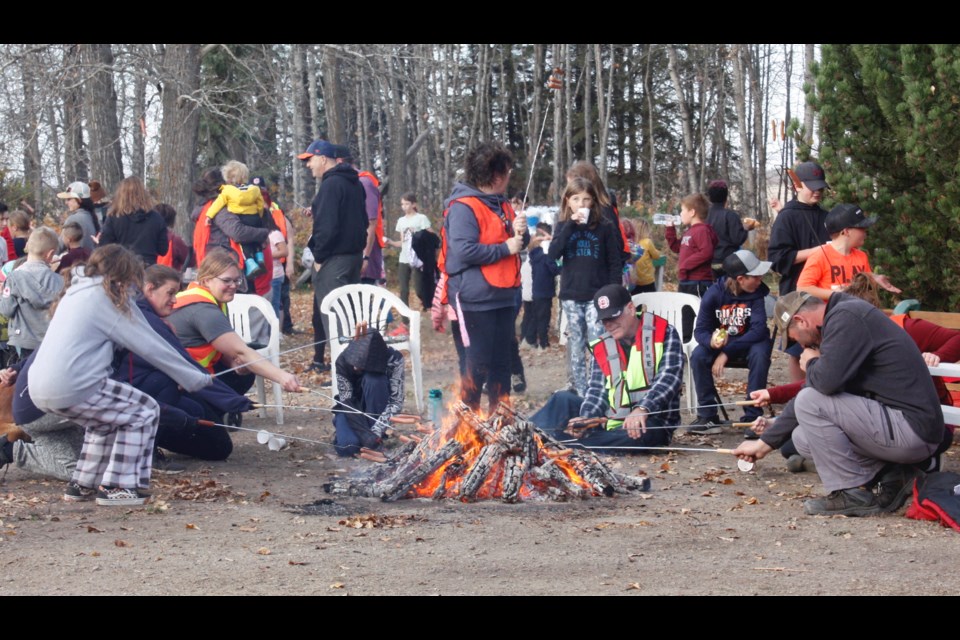 The scene at Donnie Kravontka’s residence north of Grassland as students, staff and community volunteers stopped for a quick hot dog lunch before embarking on the second half of their near-eight-kilometre walk that doubles as a fundraiser and the school’s Terry Fox Run.