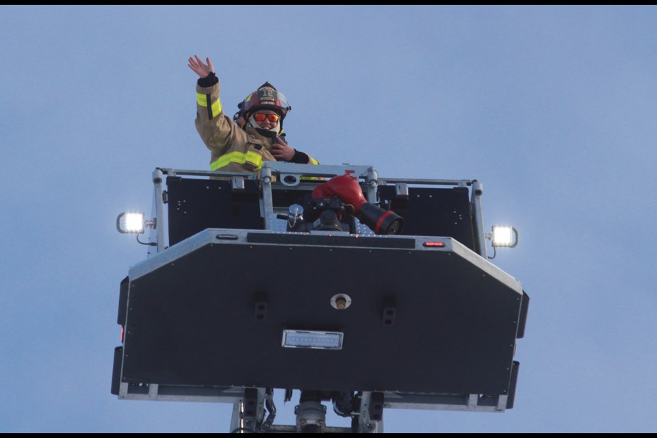 Town of Westlock fire department captain Brian Hegedus rose 106-feet into the air atop Tower 1’s bucket to cap off the 2021 Firefighter in the Sky fundraiser held Dec. 19 in the parking lot of Finney’s Your Independent Grocer store. More than 3,400 pounds of food and $3,500 was raised, making 2021 the second most successful year for the department. All donations are given to the Family and Community Support Services and the Westlock Food Bank.