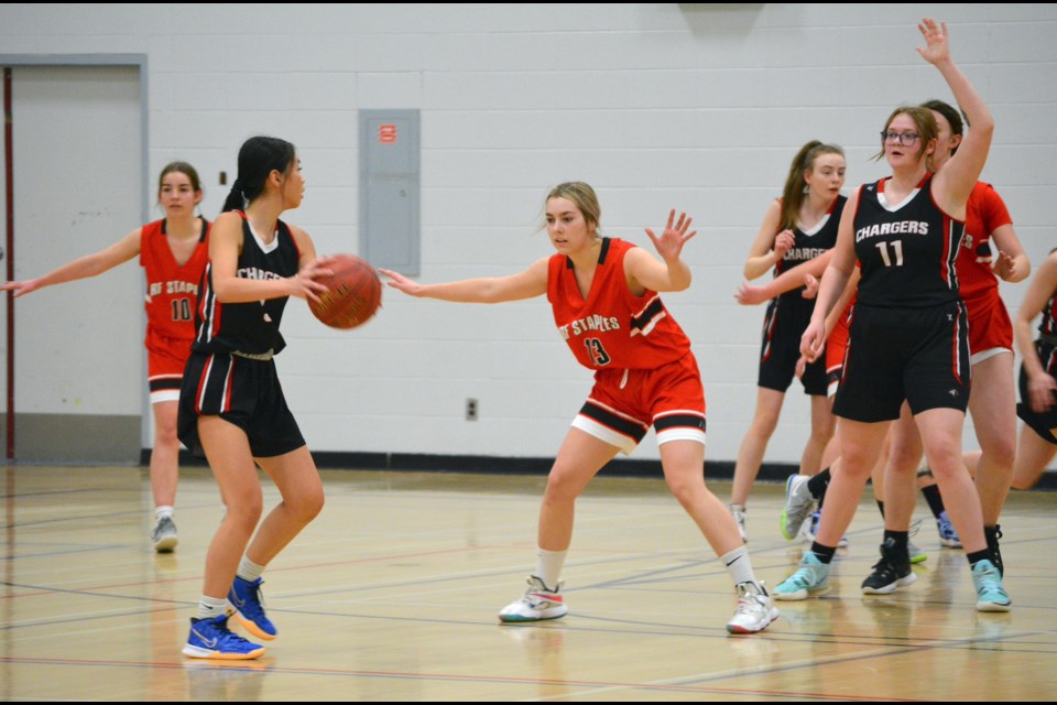 T-Birds' Breanna Montgomery stays focused on the ball while defending the play, during quarterfinals action against the Hilltop Chargers in the North Central Zone Championships, March 11 at R.F. Staples School.  