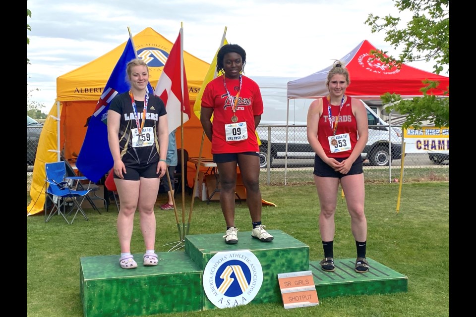 At the 2022 Alberta Schools Athletic Association (ASAA) Track and Field Provincials in Medicine Hat, June 3-4, R.F. Staples School student Paige Snyder, right, finished third in the senior girls four-kilogram shot put with a throw of 9.99 metres.