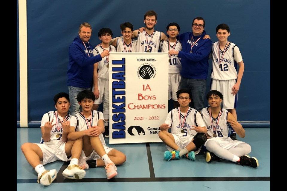 St. Mary School’s senior boys basketball team celebrated their first 1A North Central Zone title in a generation March 12 following their 66-44 win over the Breton Cougars. Back row, L-R: coach Darcy Romanuik, Pilot Demske, Riley Chattargoon Dylan Magus, Adam Ammar, associate coach Scott Rains and Josh Darr. Front row, L-R: Raine Ramos, Abe Quilonio, Arvin Alejo and Shek Alejo.