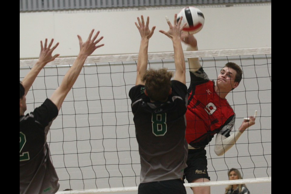 R.F. Staples School’s (RFS) senior boys volleyball team will be heading to Lethbridge for the Alberta Schools’ Athletics Association 3A Volleyball Championships Nov. 24-26 after finishing second at the North Central 3A Zone Volleyball Championship hosted in Westlock Nov. 18-19. Pictured is Grade 12 T-Bird Noah Rigney spiking a ball past a pair of Athabasca defenders during round robin action Saturday. 