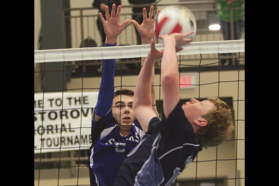 St. Mary School’s Hayden Bennett prepares for a block during Day 1 action against the Living Waters Warriors at the Joe Nestorovich Memorial Volleyball Tournament Oct. 21 at the Rotary Spirit Centre. 
Photos by George Blais/WN
