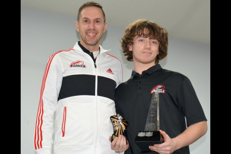 Westlock Thunderbirds running back Calyx Fertuck, who also filled several positions on the team this season, received the Robert Bokenfohr Most Valuable Player Award at the club’s annual banquet and awards night Nov. 29 at Memorial Hall. Presenting the award (left) is co-coach Jon Kramer.