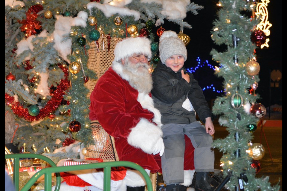 Westlock Light Up 2022 was two days of fun and kicked off with the Friday-night parade down 107th Street. Barrett Kikernik was all smiles on Santa’s knee as he and other children stopped by to visit Santa Claus in downtown following the parade. 