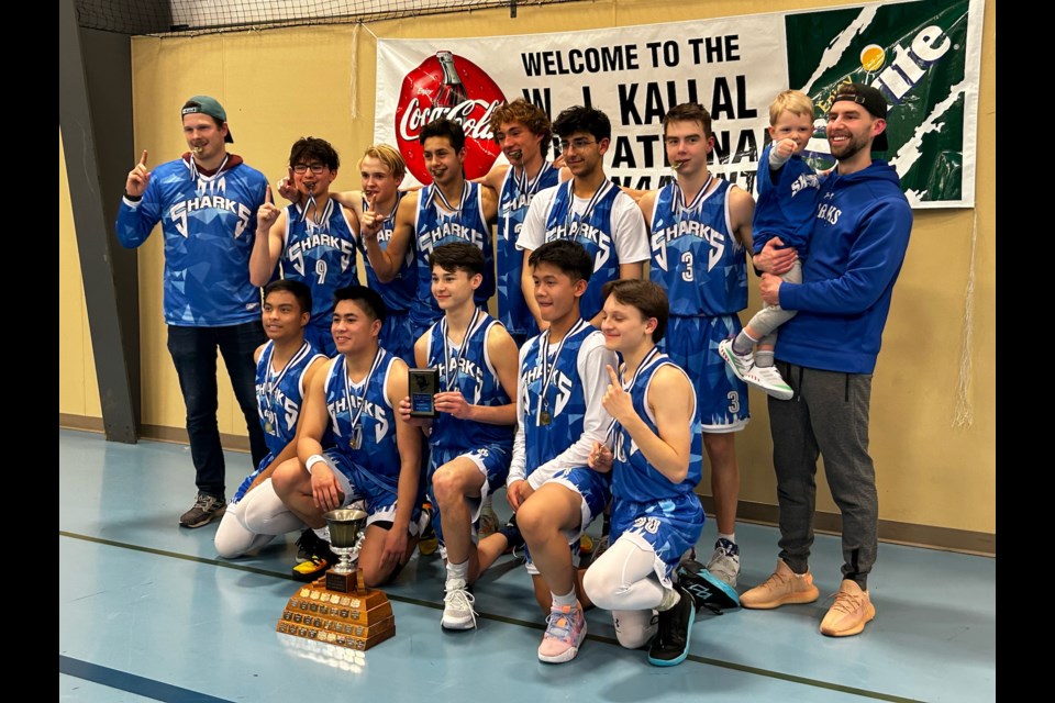 The St. Mary School (SMS) senior boys basketball team celebrates their WJ Kallal Memorial Tournament title Feb. 4 at the Rotary Spirit Centre. Back row, L-R: assistant coach Mackenzie Walker, Pilot Demskie, Jacob Demers, Riley Chattargoon, Brody Conquergood, Adam Ammar, Hayden Bennett and head coach Ty Snell with his son Harrison. Front row, L-R: Shecaniah Alejo, Raine Ramos, Josh Darr, Abe Quilonio and Jaxon Magus.