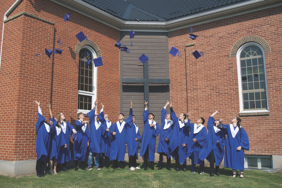 The class kicked off a day of celebration with the traditional cap toss in front of the St. Mary of the Assumption Church. L-R: Rylee Machalek, Amber Urtal, Logan Gallagher, Declan Hartman, Marshall Eastman, Ryker Rimmer, Brett Batog, Shecaniah Alejo, Adam Ammar, Austin Teske, Leelyn Shank, Raine Ramos, Cassandra Trotta-Desjardins and Zoey Rondeau. 