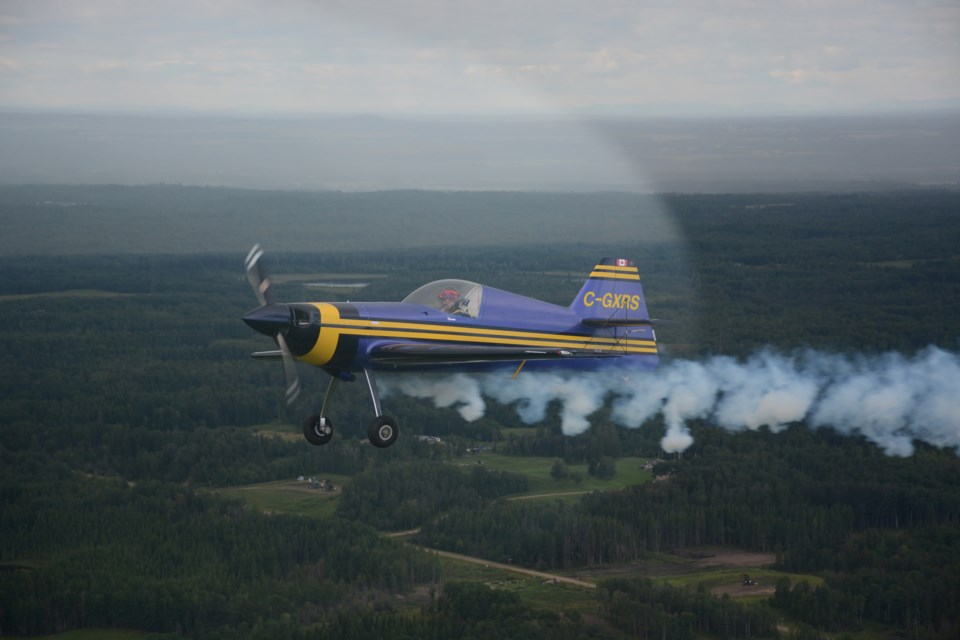 Scott Harris, who  flies out of Cooking Lake, giving a bit of smoke demonstration with his Gimball G2 plane during the Edmonton Area Air Tour held Aug 8.

Les Dunford/T&C