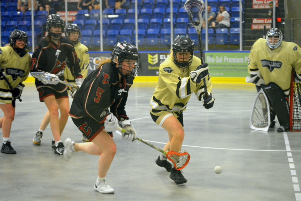 St. Albert Drillers’ Ruby Kubinec, who’s one of eight Westlock girls on the squad, fights for the ball during their July 9 bronze-medal game against the Cardinals at the 2023 Alberta Major Female Provincial Lacrosse Championships at the Rotary Spirit Centre. The Drillers wound up dropping the game 12-5 to finish in fourth place.    