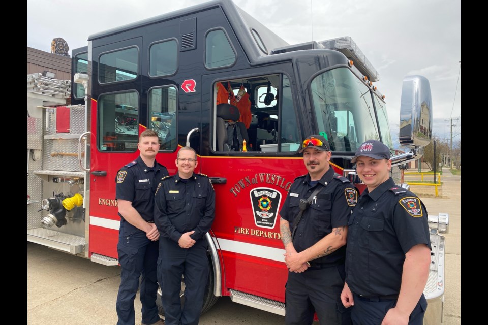 L-R: Town of Westlock firefighters Mathew Johnsen, deputy chief Kris Olsen and firefighters Brad Watson and Nate Day hit the road in Engine 2 for an 840-kilometre trek northeast to Rainbow Lake May 8 to “assist with structural protection of the town.” The four were expected to be back in Westlock by Saturday, May 13.