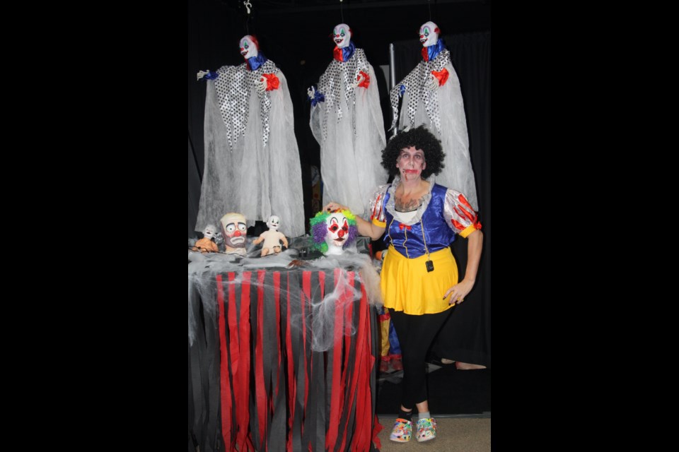 Fiona Janz, dressed up as a dark version of Snow White, poses next to one of the spooky displays she set up for the haunted house held at the Westlock Aquatic Centre on Oct. 27. Trick-of-treaters who braved the terrors of the haunted house receiving a free treat bag. This weekend marked a number of Halloween-themed events, such as the Barrhead Community Pumpkin Walk on Friday night.
Kevin Berger/WN