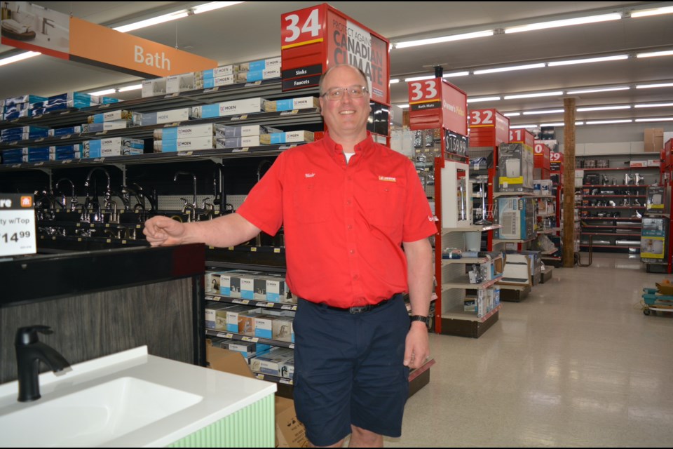Westlock Home Hardware dealer-owner Blair Kneller stands in one of the expanded sections of the store, which almost doubled the square footage. They welcomed customers to the newly renovated store during a grand opening May 4-6. 