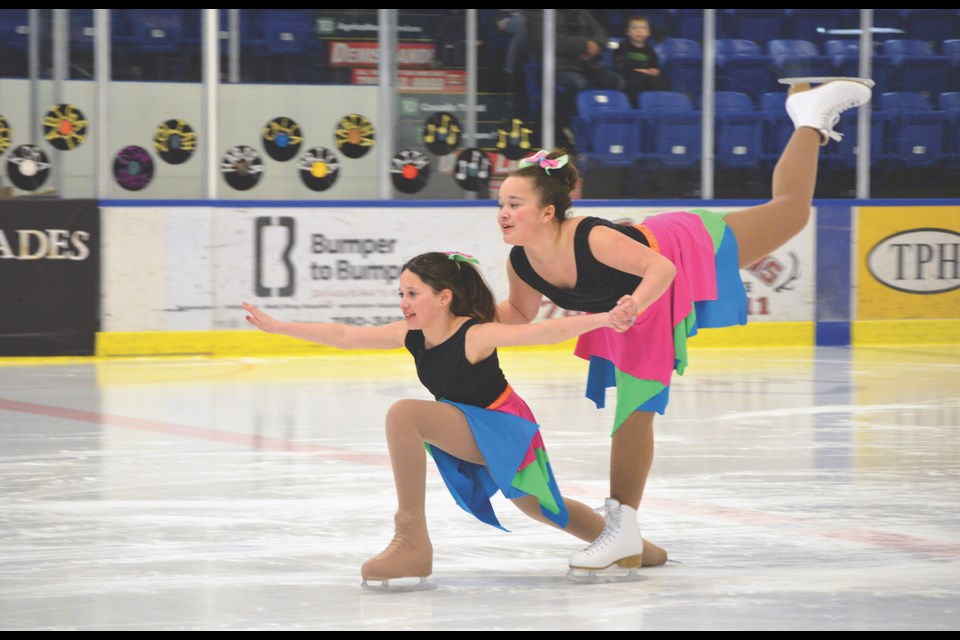 Performing their STARSkate Duet to the song I Wanna Dance with Somebody are Calla Johnston, bottom and her sister Priya.