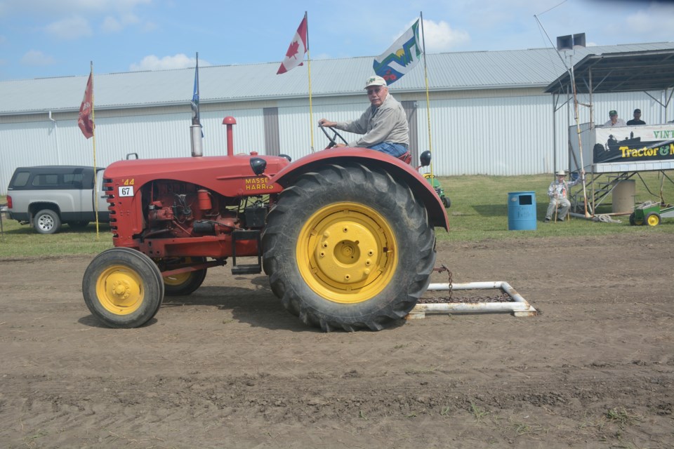 Vic Riopel gives a quick look at the camera after successfully completing the timed "chain in the box" event. 