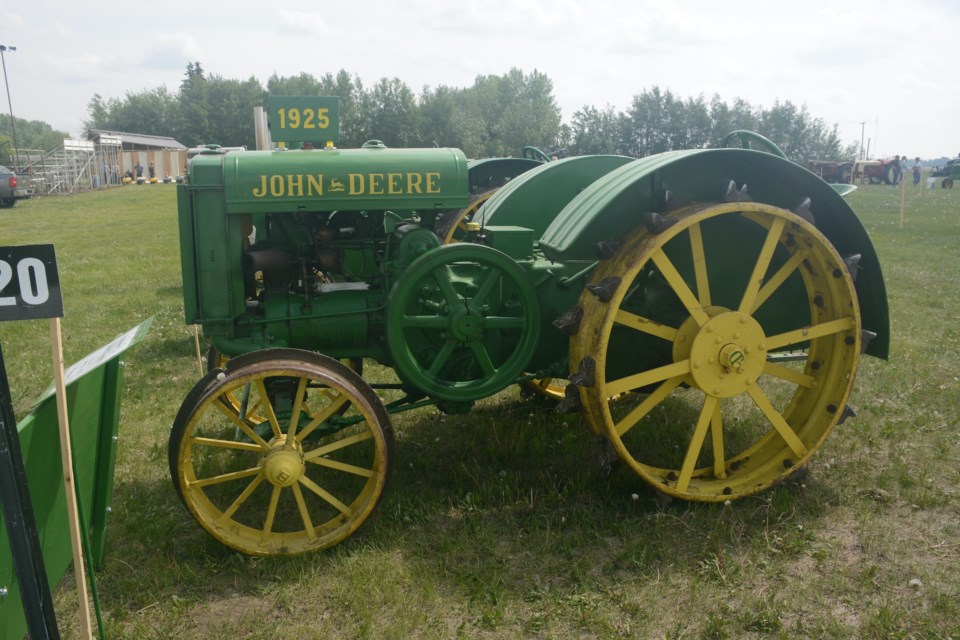 Joe Jr. Schafers’ 1925 Model D John Deere "spoker" tractor, nicknamed for the spoked flywheel shown on the left side. This tractor was manufactured just two years after John Deere began manufacturing its own.