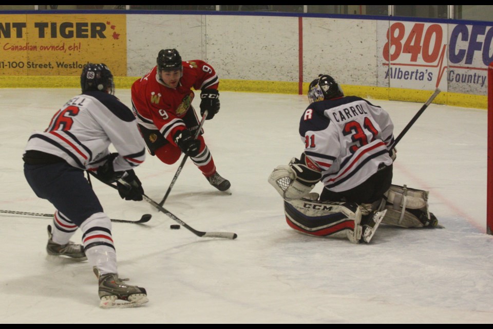 The Westlock Senior Warriors’ season came to a tough end Feb. 8 at the Rotary Spirit Centre following a 10-1 loss to the Red Deer Rustlers, who swept the best-of-five opening round playoff series.  Pictured above is Warriors’ forward Scott Ivey cutting to the net during first-period action.