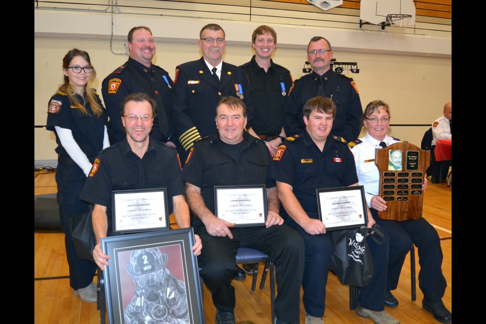 It was all smiles for the award recipients during Westlock County’s annual firefighter’s appreciation night Dec. 3 at the Jarvie Community Centre. Award winners included, back row, L-R: Meagan Smith, Barry Nyal, fire chief John Biro, Mike Mielke, and Perry Lumayko. Front row, L-R: Dave van de Ligt, Chris Drezzick, Shaun Cormier and Roberta Halliday. Missing from the photo is David Kaliel (25 years of service).
