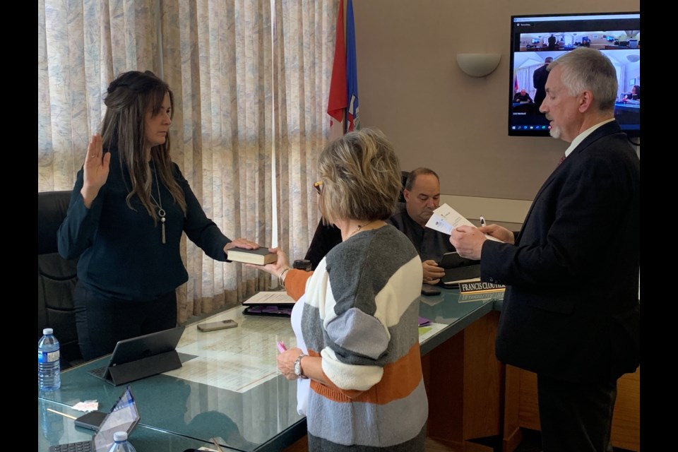 Westlock County reeve Christine Wiese takes the oath of office from CAO Tony Kulbisky, while municipal clerk/council executive assistant Dianne Johnston holds the Bible during the municipality’s Oct. 25 organizational meeting. This will be the second-straight year that Wiese will serve as reeve.