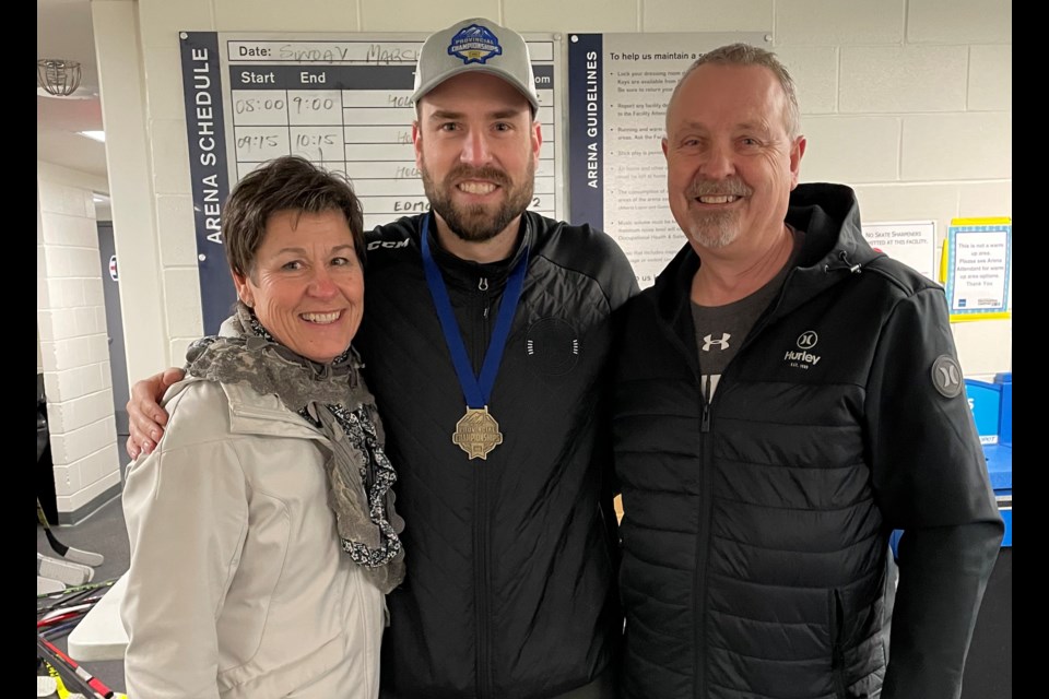 Westlock’s Brett Wold (centre) celebrates the Alberta Female Hockey League (AFHL) Provincial Championship his team, the U18 ‘AAA’ Red Deer Sutter Fund Chiefs, won March 26 in Edmonton. Joining him after the game were his mom and dad, Tina and Randy.