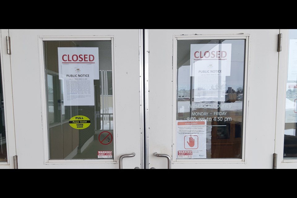 The entryway to the Westlock County administrative office is plastered with closed signs and notices after a potential exposure of an employee to the COVID-19 virus was reported March 13. The office is still functioning, but is closed to the public until further notice. The staff members test results are expected next week.
Chris Zwick/WN