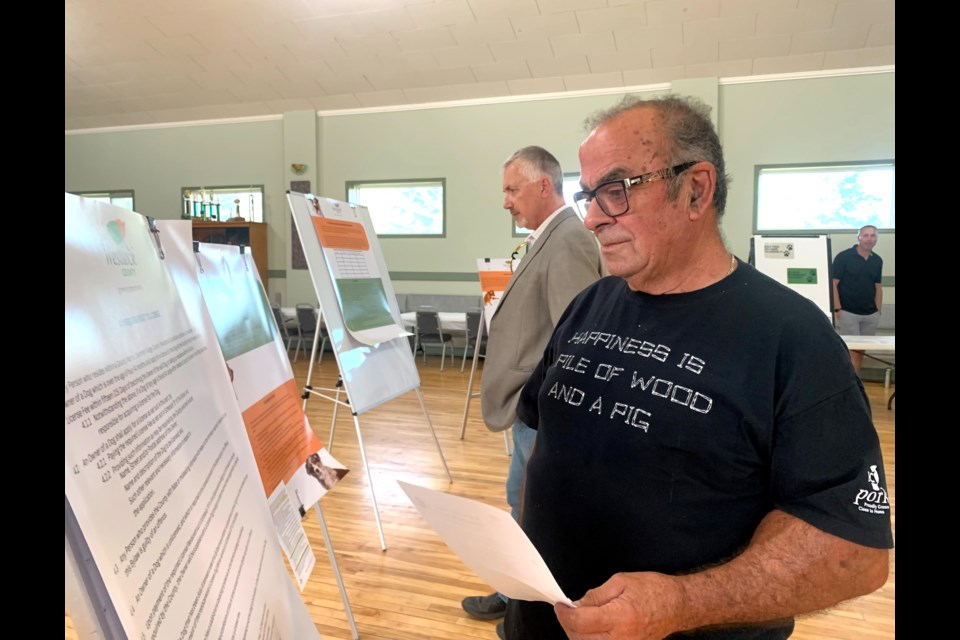 Rolly Fagnan of Vimy looks over information during the Responsible Animal Ownership Bylaw Open House at the Vimy Community Hall on Sept. 5. 