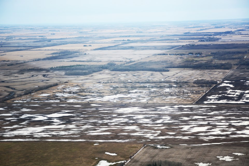 A field west of the Pembina River northwest of the Sunniebend Bridge. It will be some time before any work can be done on this field. Les Dunford/Town & Country