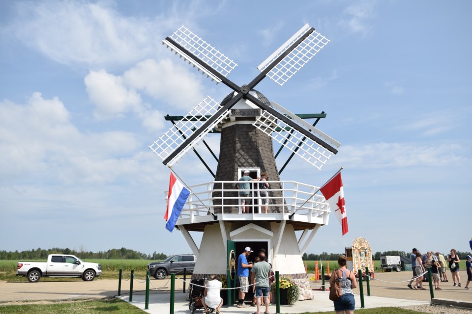 A picture of the replica life-sized windmill in the Neerlandia Co-op parking lot.