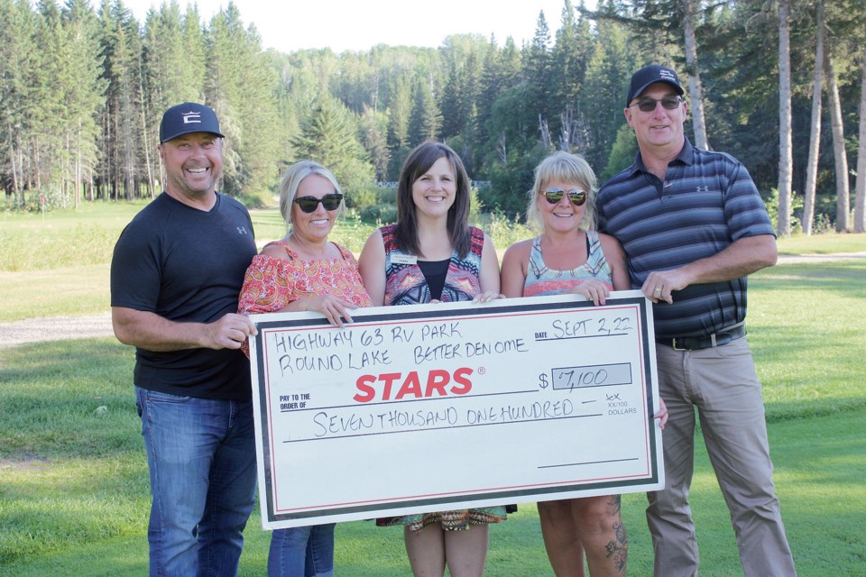 Kevin Mosich, Monique Mosich, STARS community engagement officer Shannon Paquette, Lisa Penney and Darrin Penney, as the campground owners handed over a $7,100 cheque for STARS at the Riverbend Golf and RV Park near Wandering River Sept. 2. 