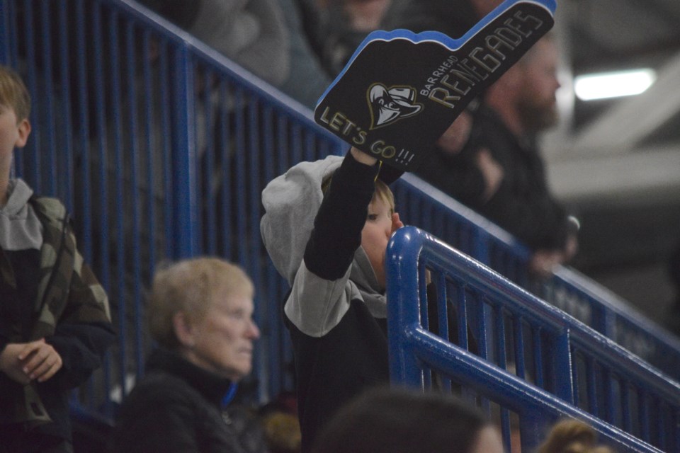 A young fan celebrates a Barrhead Renegade goal.