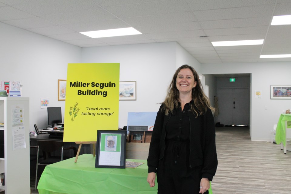 Executive director Katie Robinson with their big announcement display.  