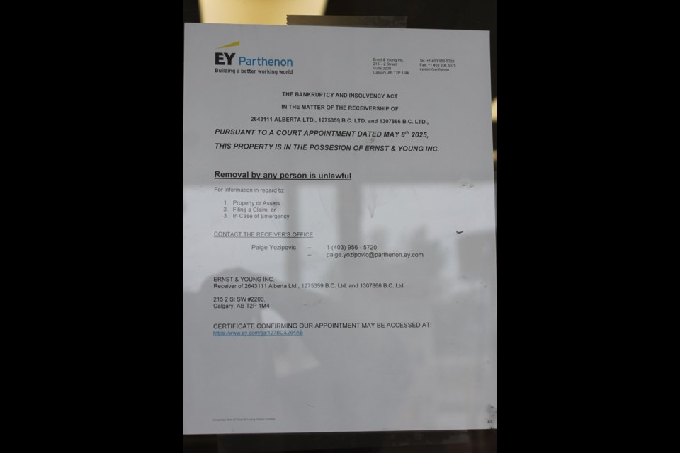 The notice on the door for the Shell gas station on 100 Street. 