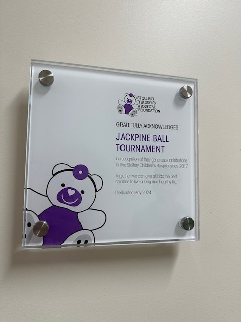 The plaque received from the Stollery Children's Hospital for The Jackpine Ball tournaments overall achievement of donating over $100,000. Photo supplied by Jen Wood