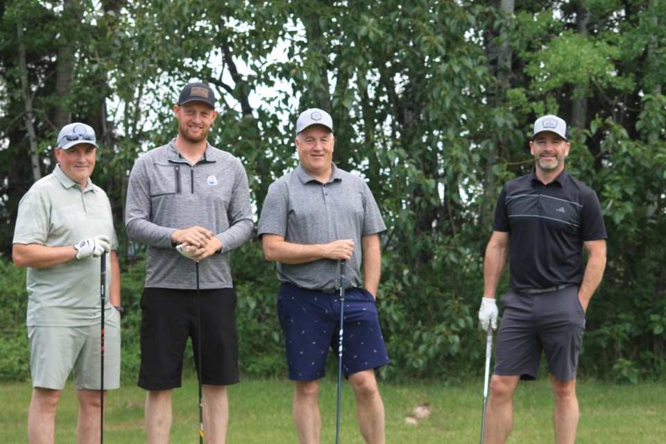 One team poses for a group photo before continuing on their tournament route. 
L-R: Randy Kruger, Josh Kaliel, Warren Wylie, Don Carlson. Leanna Bressan/ Westlock News.