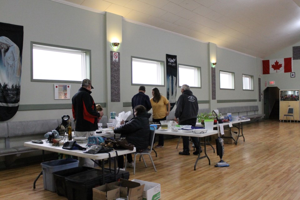 Members from across the county show up on the rainy Saturday to do some shopping. 