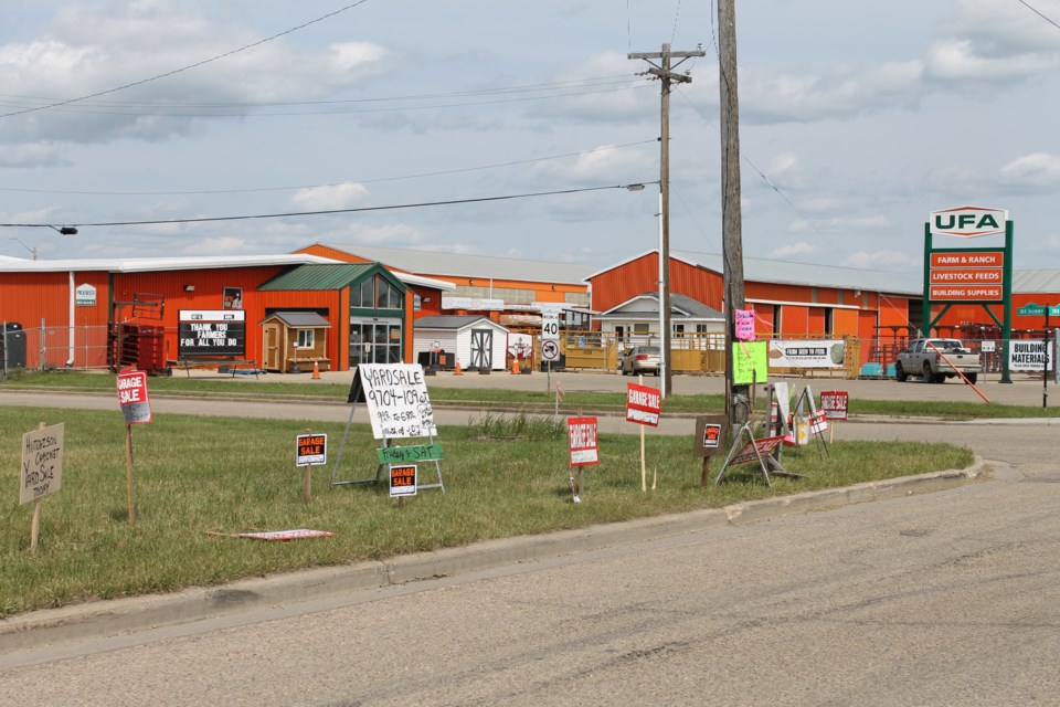 Dozens of garage sale signs lined by HWY 18 on Saturday, June 21 for the Westlock Town-Wide Garage Sale.