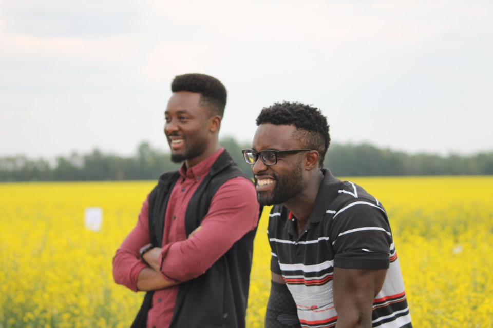 Stephane Trazo (left) and Roosevelt Quiah (right) discussing their innovative drone technology at the Gateway Research Organizations Pulse and Canola Field Day on July 28, 2025.