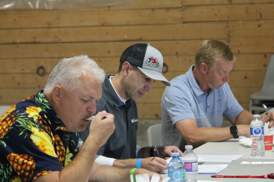 Before the great county bake competition on Aug. 17, Tom Vesley (left), Jon Kramer (middle) and Vance Nakonechny (right) tested each baked good for taste and presentation. 