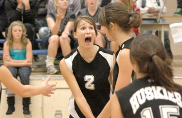 Madison Chamzuk (c) shows a little excitement with her Boyle Husky teammates after scoring a point in Friday night&#8217;s senior girl&#8217;s volleyball match against the