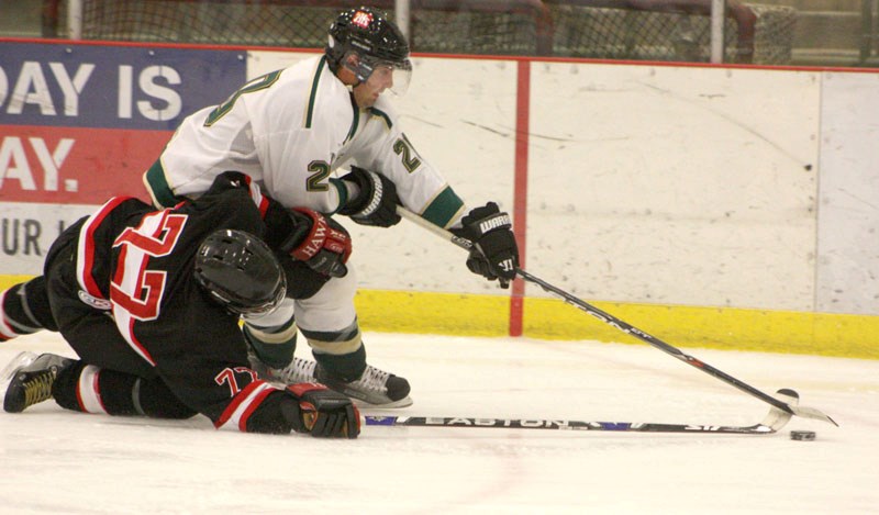 Bobby Roy/AA Athabasca Ace Andy Skoreyko skates past Chad Paulson of the Slave Lake Winterhawks in the second period of Sunday&#8217;s game