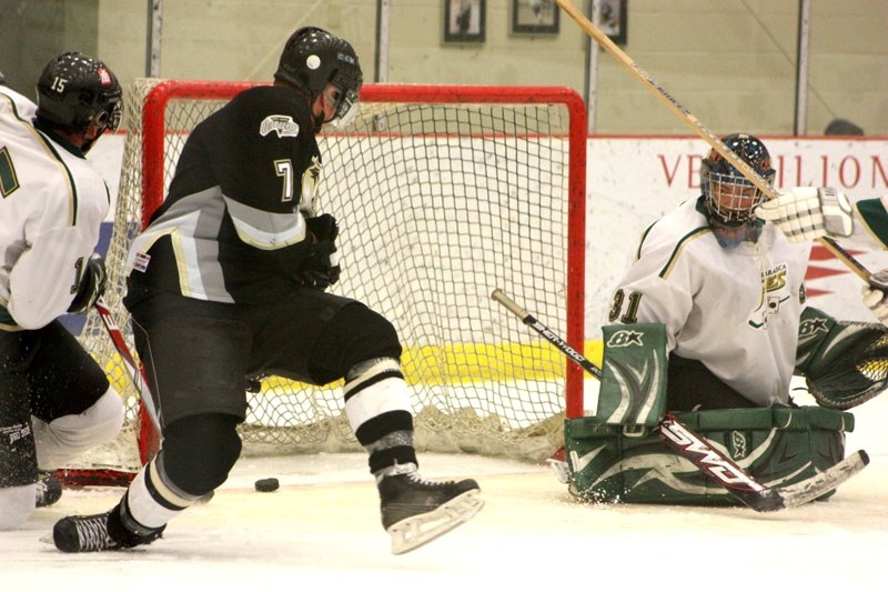 Athabasca Aces&#8217; goaltender Jeff Creaser watches helplessly as the puck trickles past the line for the Onoway Ice Dogs third goal of the game in the middle of the second 