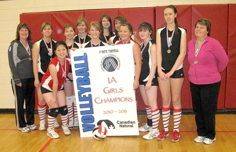 The senior girls&#8217; Boyle Huskies volleyball team poses with their 1A zone champions banner on Nov. 20 after defeating the St. Mary Sharks from Westlock. The tournament