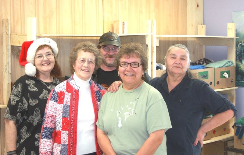 The staff at the Boyle Food Bank, (l-r) Carolyn Gale, Gwen Hall, Steve Wilcox, Marie Gladu and Leeanna Pavnell, are all smiles on opening day after an arduous weekend moving
