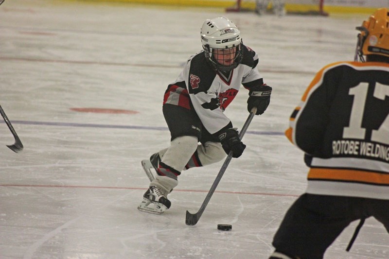 Hunter Marshall of the Boyle Blazers atom team breaks into the enemy zone during a tournament game against Athabasca on Saturday. Boyle lost 4-3 in a shootout.