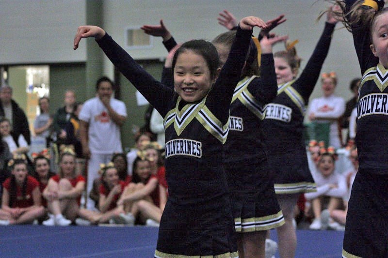 LTIS Grade 4 cheerleader Regina Shim shines in front of the judges and spectators.