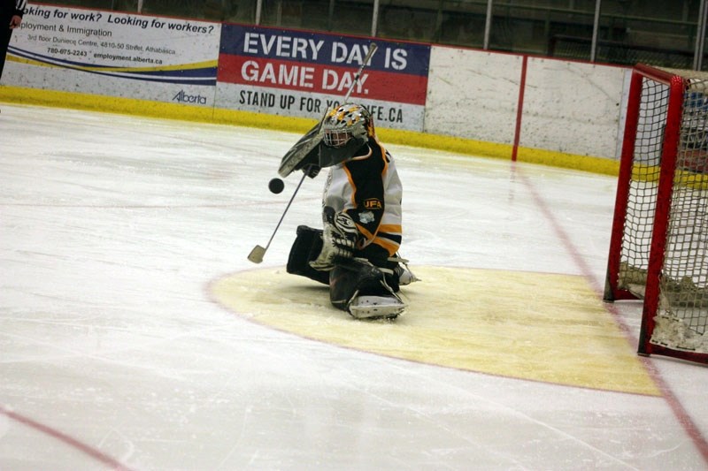 Athabasca Peewee &#8216;A&#8217; goaltender Scott Danyluk makes a stop during a game against Barrhead on Saturday. The Hawks lost 6-1.