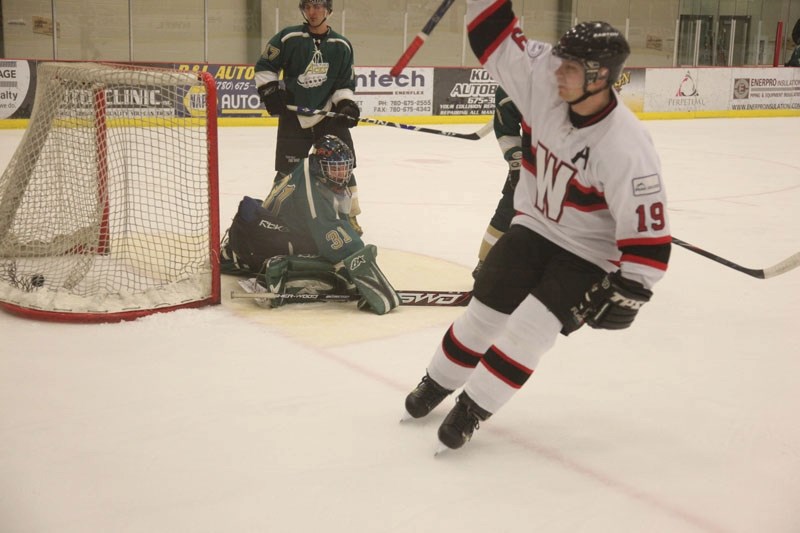 Athabasca Aces goaltender Jeff Creaser and forward Brett Topola can only watch as a member of the Slave Lake Winterhawks celebrates his goal during game two of the North