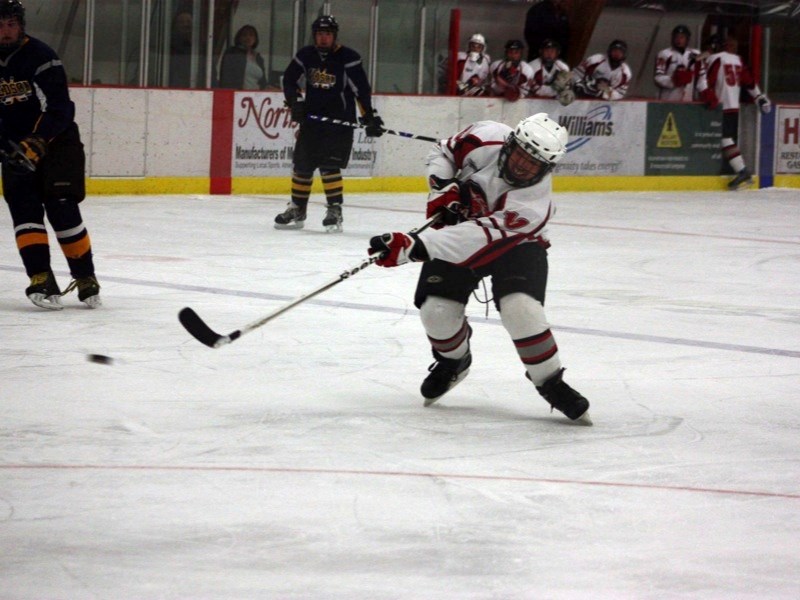 Jaize Tostinyuk (10) fires a shot at the Edson net during game two of the league championships on Wednesday.