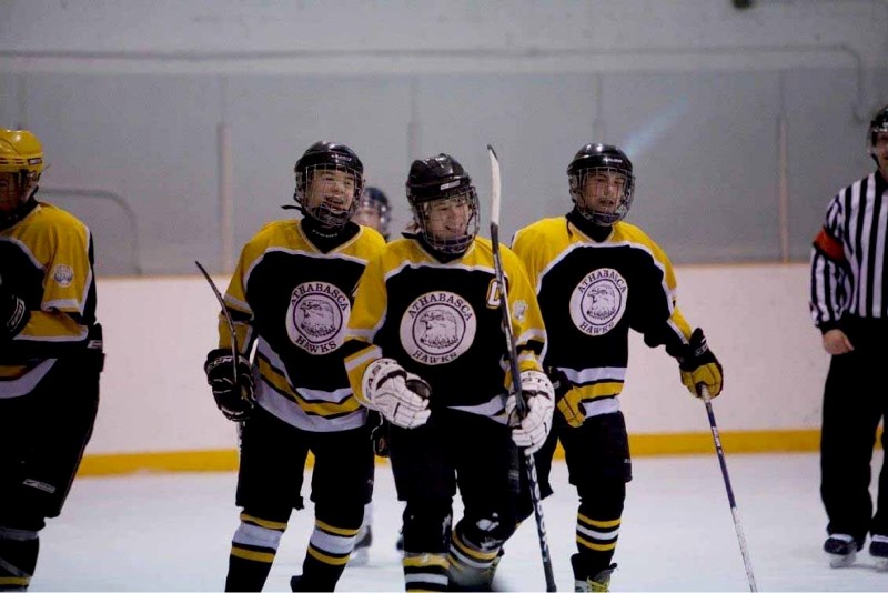 Hawks captain Tyler Young (centre) is all smiles after a goal during his team&#8217;s 4-2 win over the Wetaskiwin Moose.
